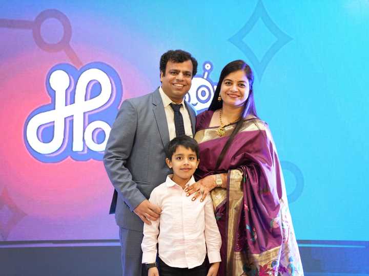 Ankit Dhir with his wife and son on stage at the HabileLabs 10th anniversary celebration